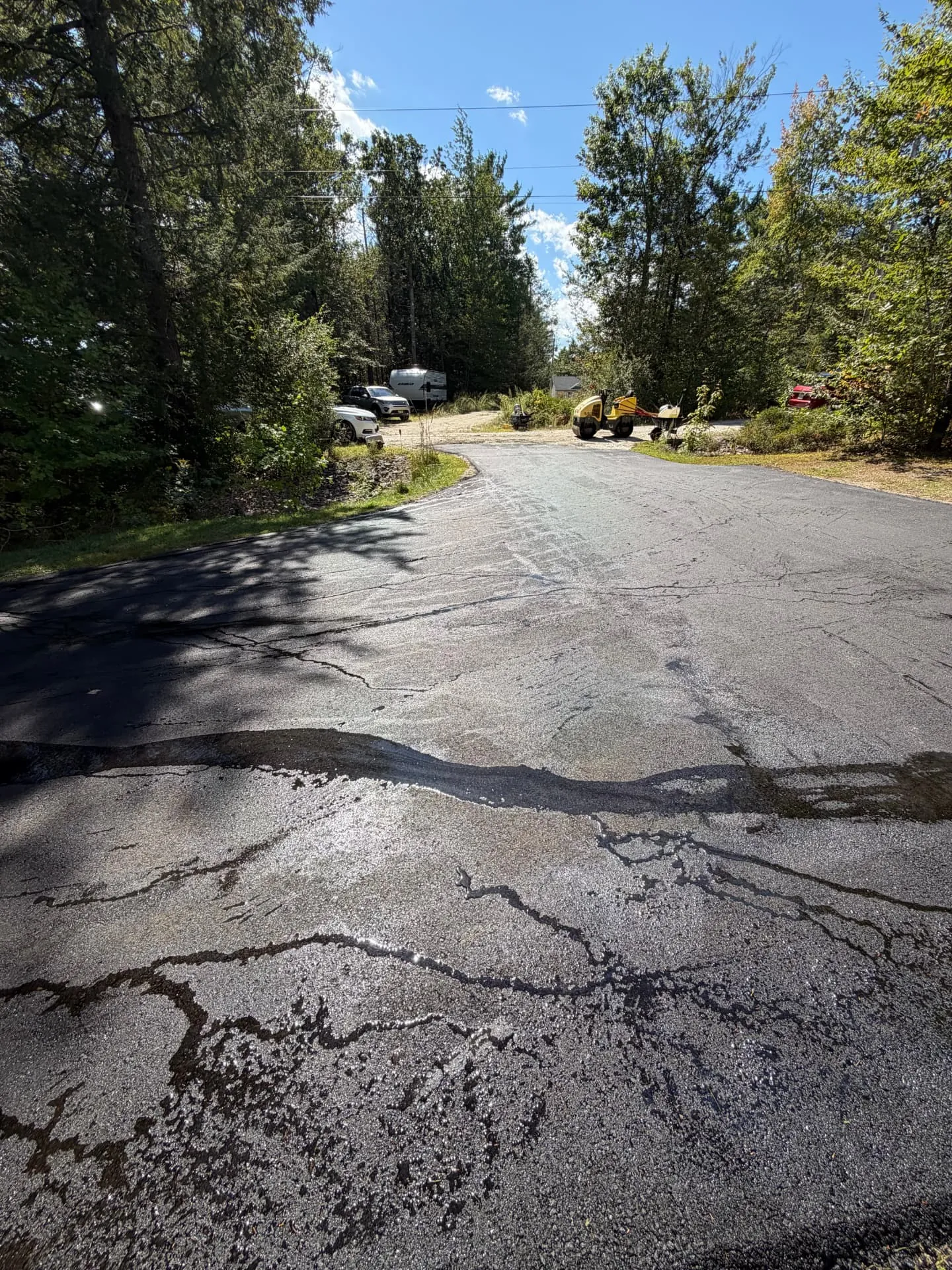 Driveway crack sealing and patching with roller on site